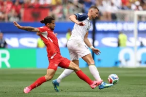 Switzerland Top Group B, Canada Sneak Through